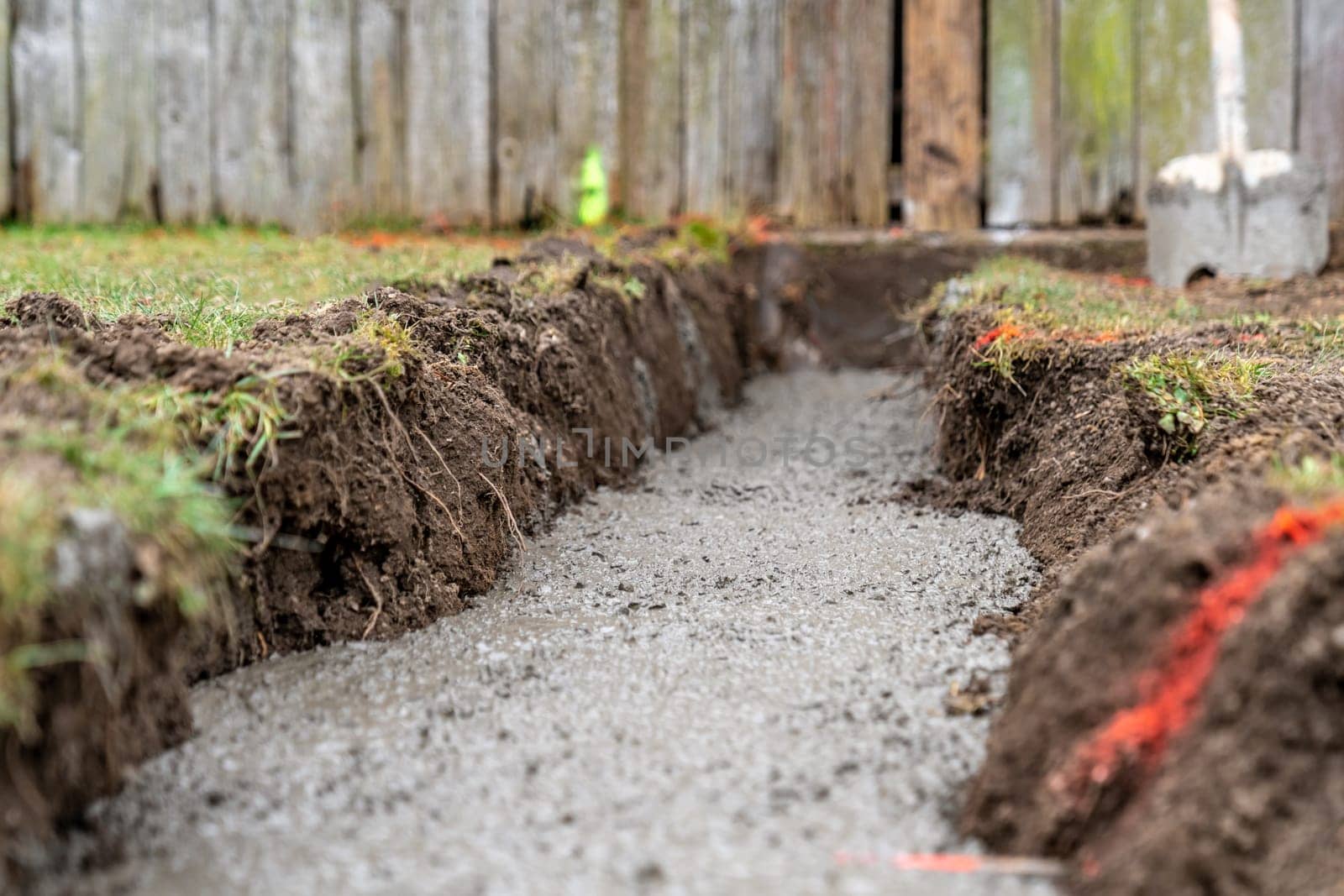 concrete foundation in the ground for building construction.