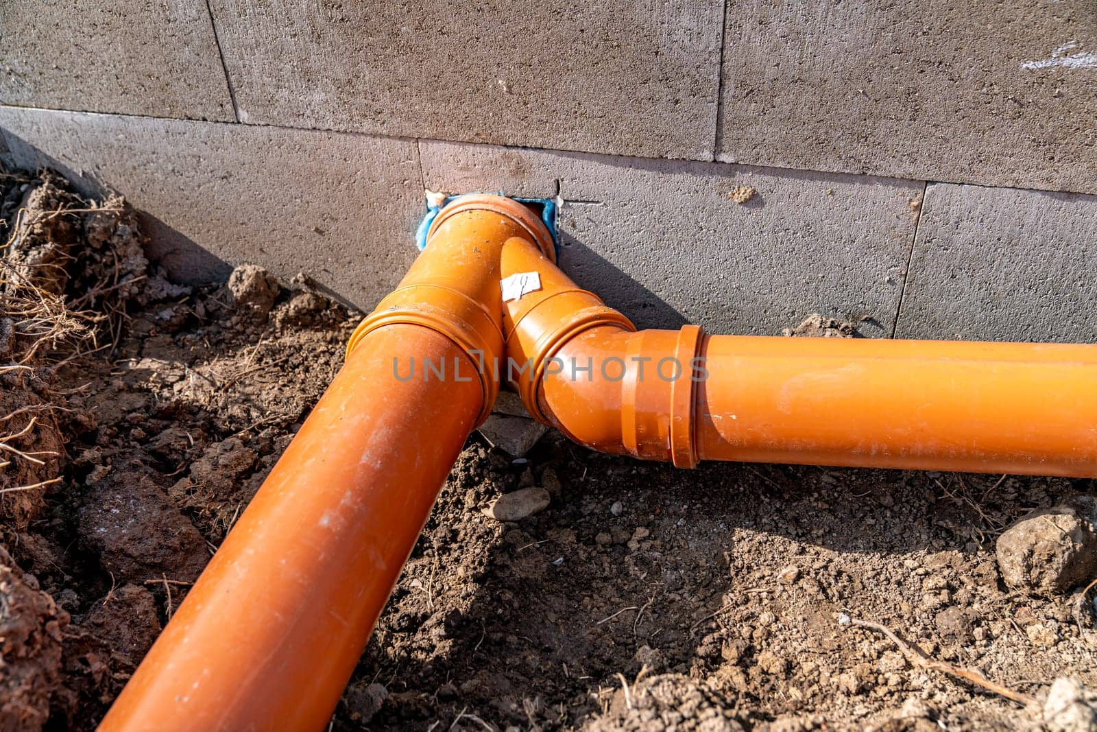 sewage system made of plastic PVC pipes in the ground.