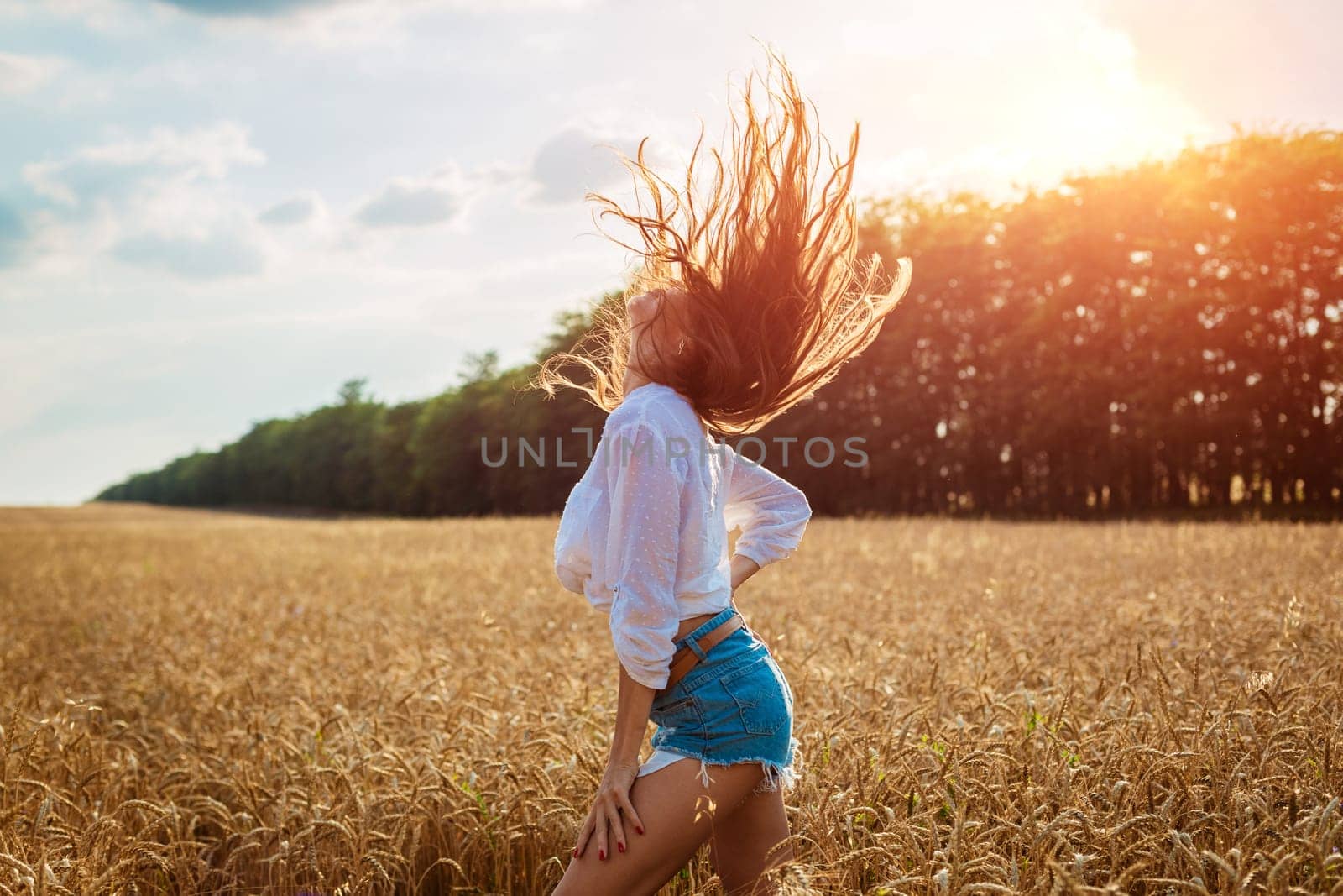 Beautiful young woman in wheat field. Cute brunette girl by EkaterinaPereslavtseva