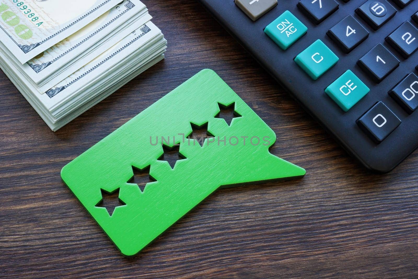 Cash, calculator and good five stars rating. Credit union reviews concept. by designer491