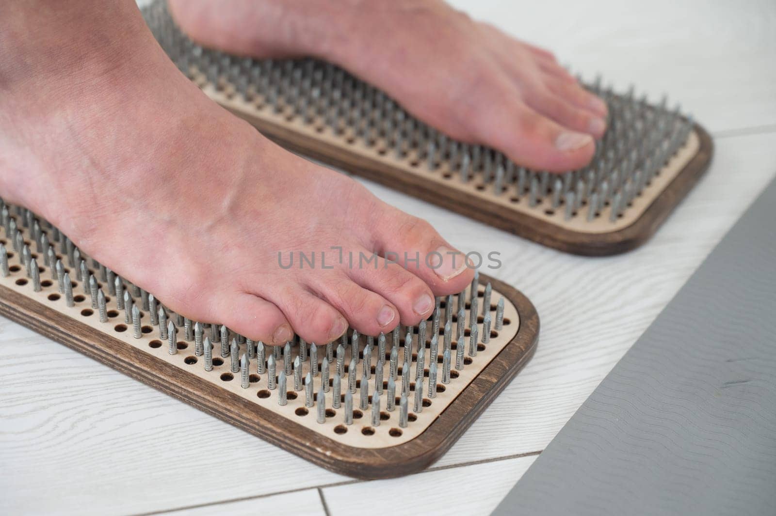 Close-up of female feet on sadhu boards