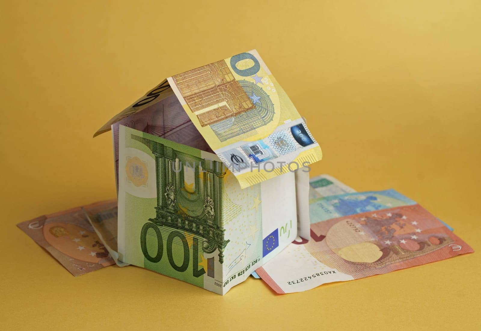 House made from euro banknotes concept for real estate prices, mortgages or home financing