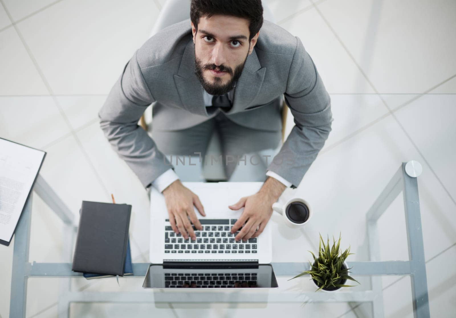 Man working in modern office with laptop
