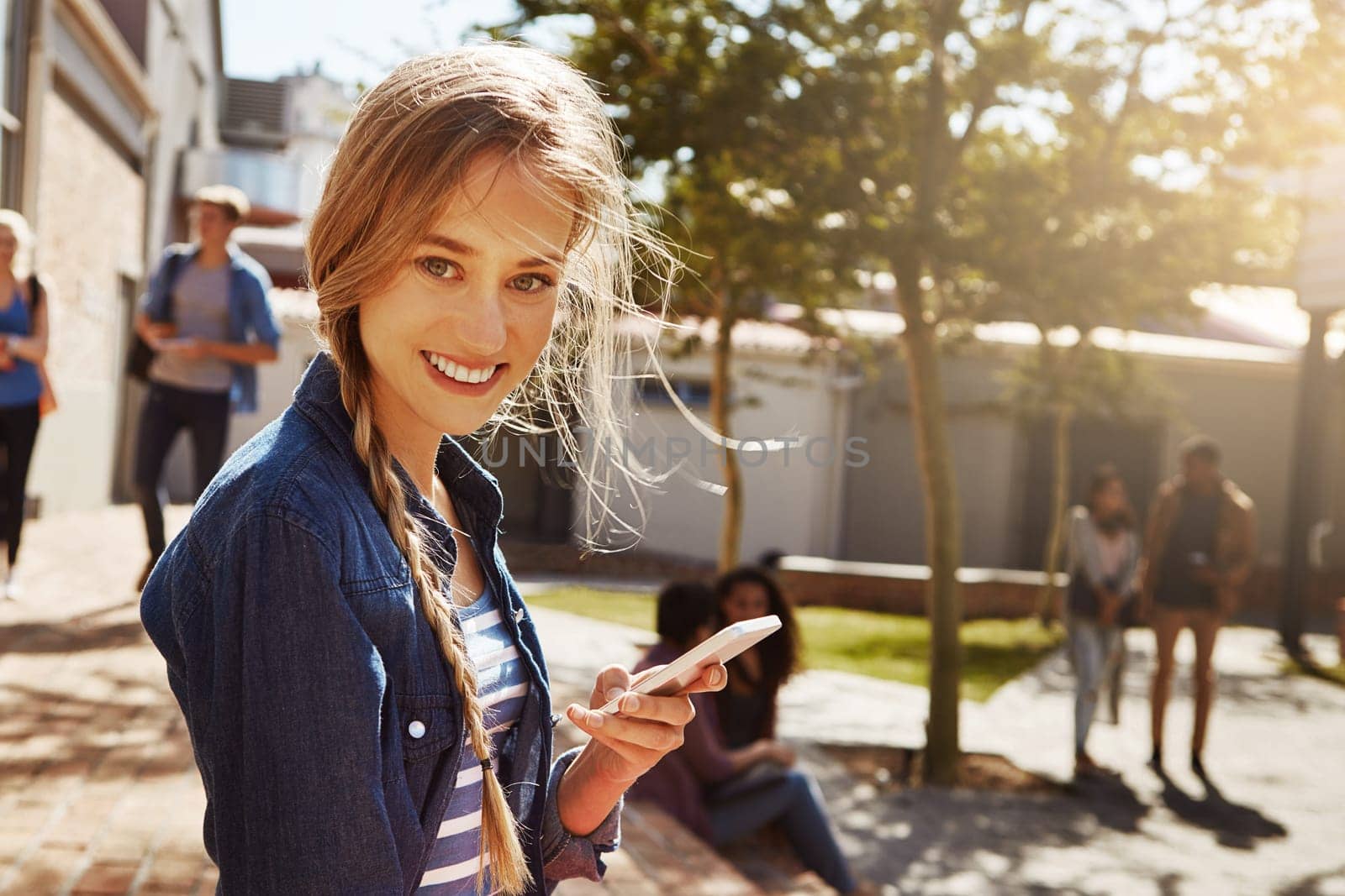 Lets see when my next class starts...a student using her cellphone on campus