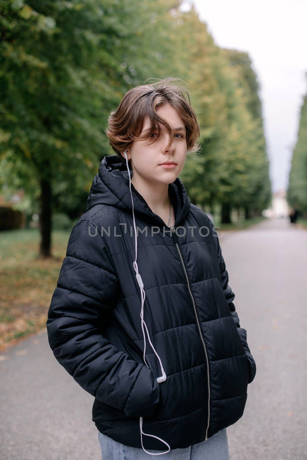 Beautiful Teenage Girl in the Park in Autumn. Portrait of a beautiful smiling girl teenager on a sunny day. Autumn season. Beauty Romantic Girl outdoor party. Beautiful teen model girl on a park. In autumn. The glow of the Sun, Sunshine. Illumination. Tinted by Andrii_Ko