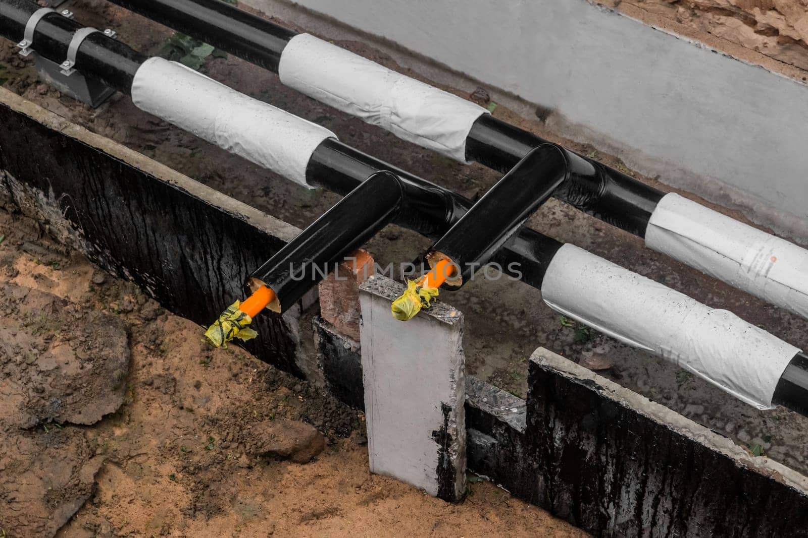 Repair of the water line of the heating main pipe in the ground trench pipeline at the construction site work industry.