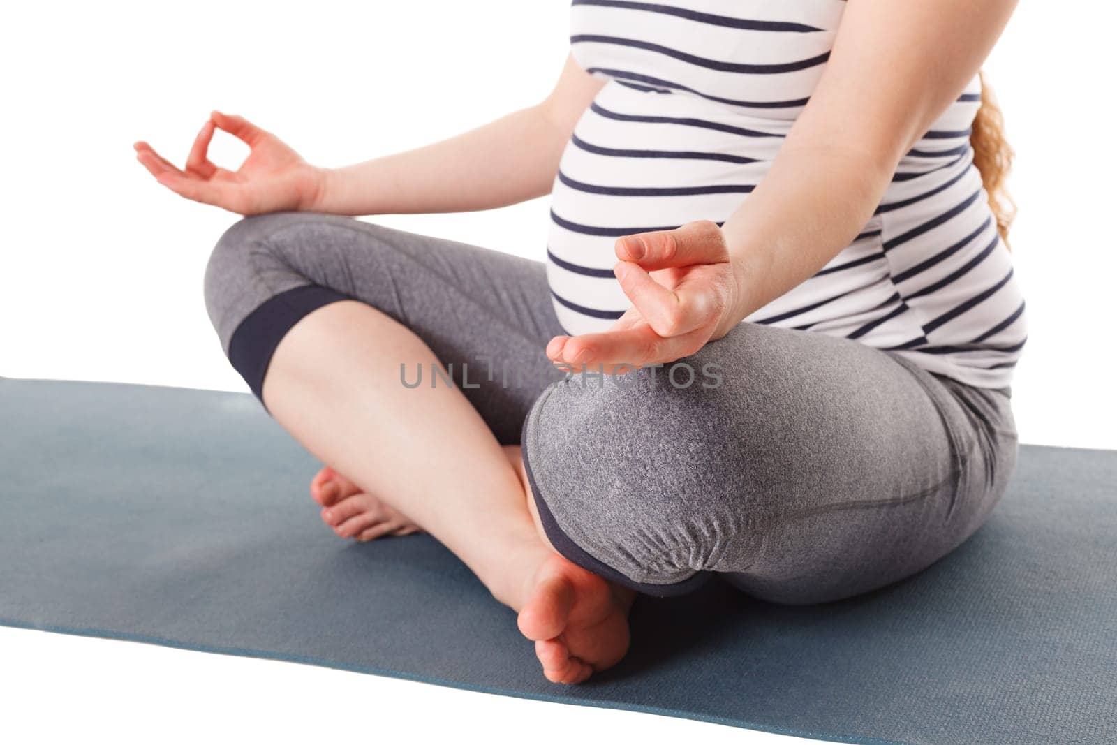 Pregnant woman doing yoga asana asana Sukhasana with chin mudra by dimol
