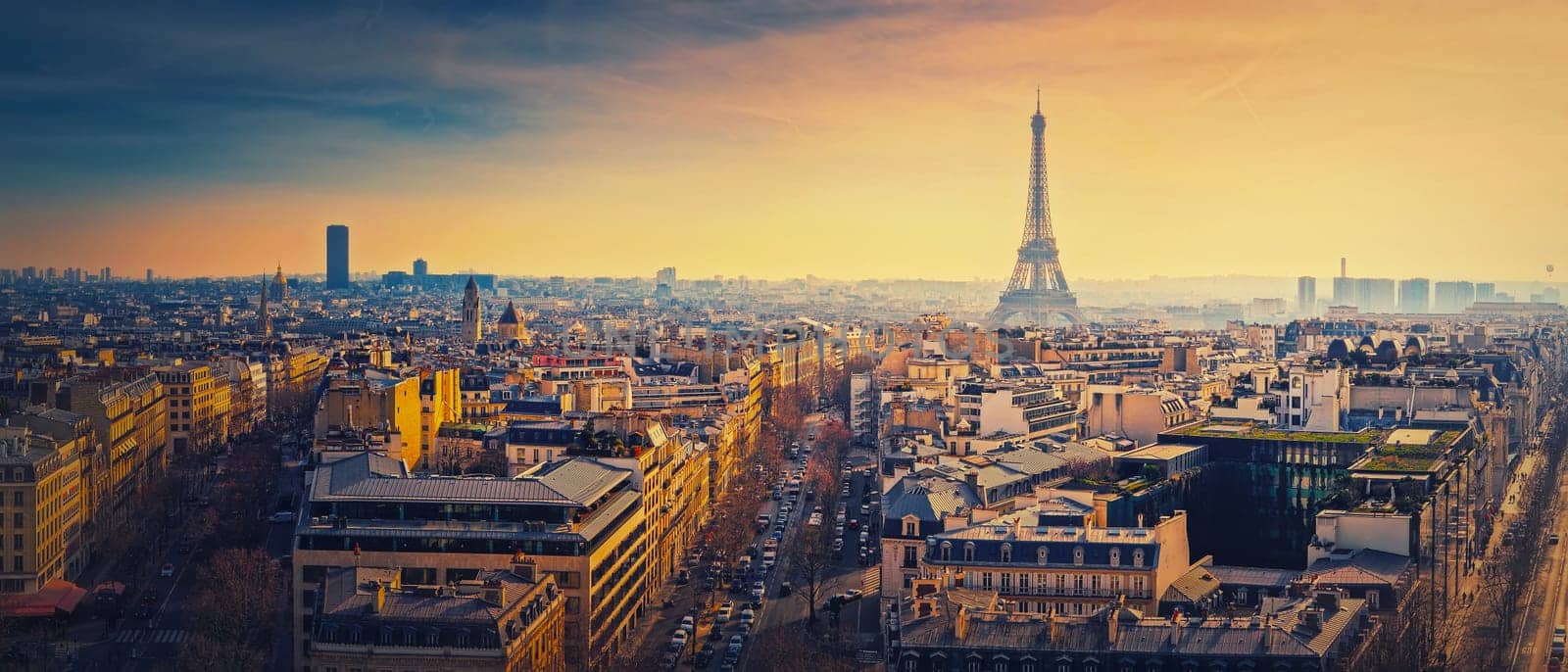 Sightseeing Paris panorama with view to the Eiffel Tower, France. Beautiful parisian cityscape sunset scene. Romantic view over rooftops of historic buildings and landmarks. Holiday destination by psychoshadow