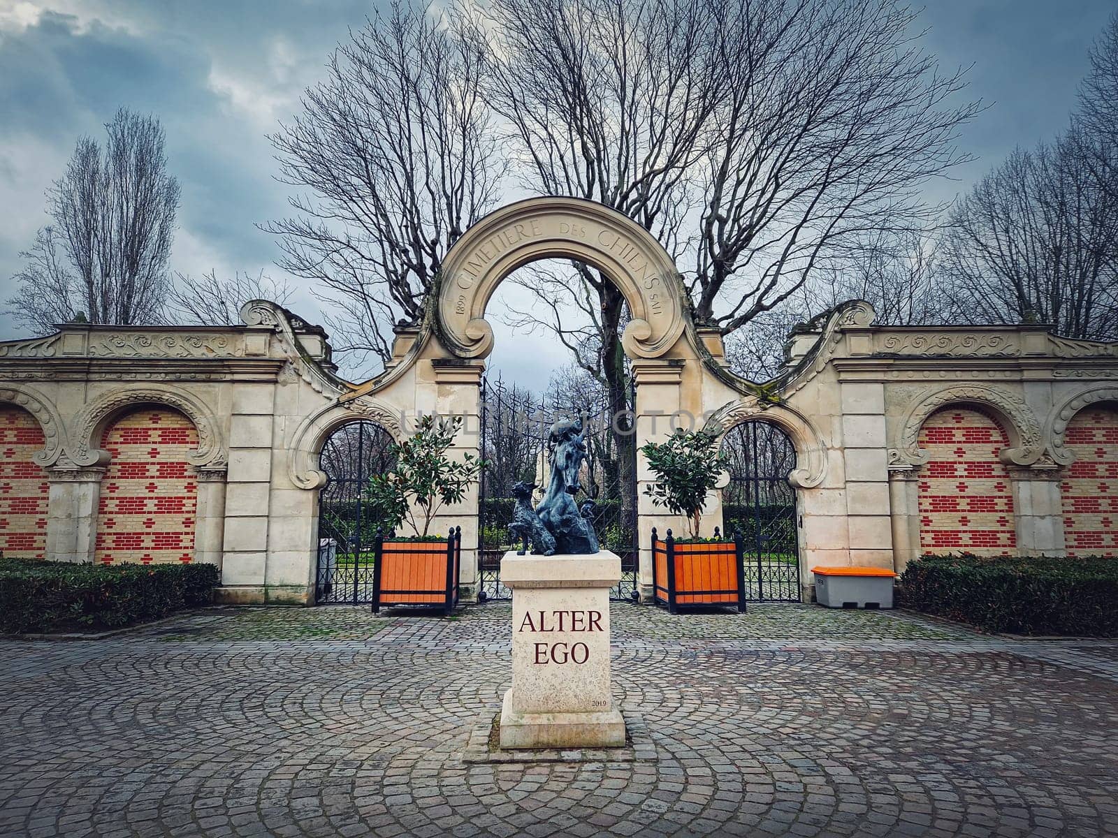 Dogs Cemetery (Cimetiere des Chiens) in Asnieres-sur-Seine, Paris France. View to the main gate and entrance to the world oldest public pet graveyard 
