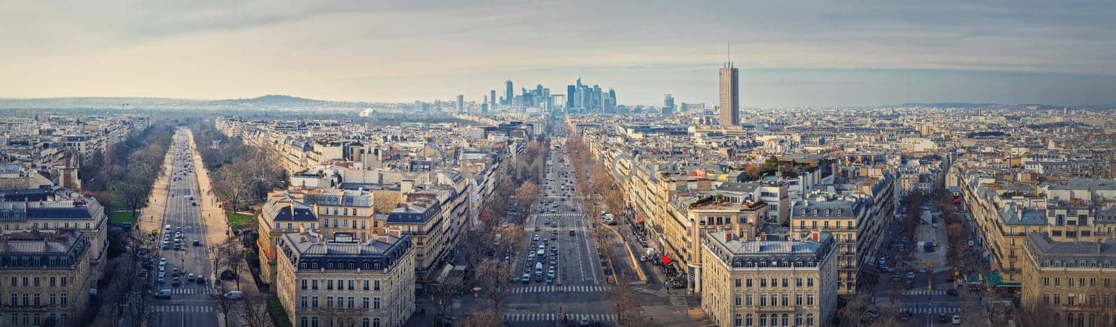 Aerial Paris cityscape panorama with view to La Defense metropolitan district, France. Champs-Elysee avenue, beautiful parisian architecture, historic buildings and landmarks on the horizon