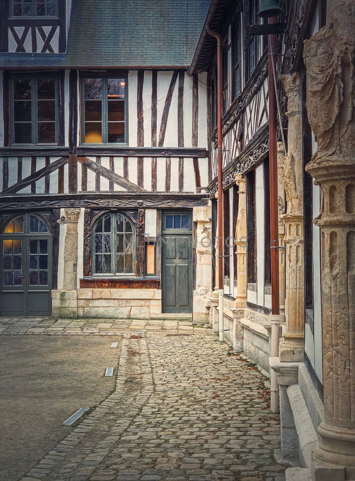 Saint-Maclou aitre, aster courtyard of medieval cemetery. Fachwerk architecture, half timbered facades details of the buildings located in Rouen, Normandy, France