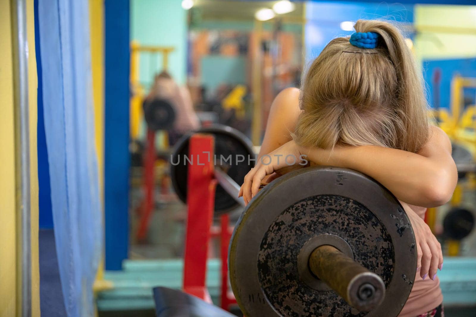 Woman exhausted from intense training at the gym by fotodrobik