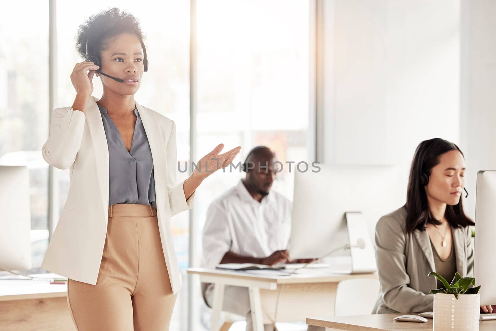 Call center, black woman and business communication in office, coworking sales agency and customer service. Female telemarketing agent talking on headset for help, crm advisory and telecom support.