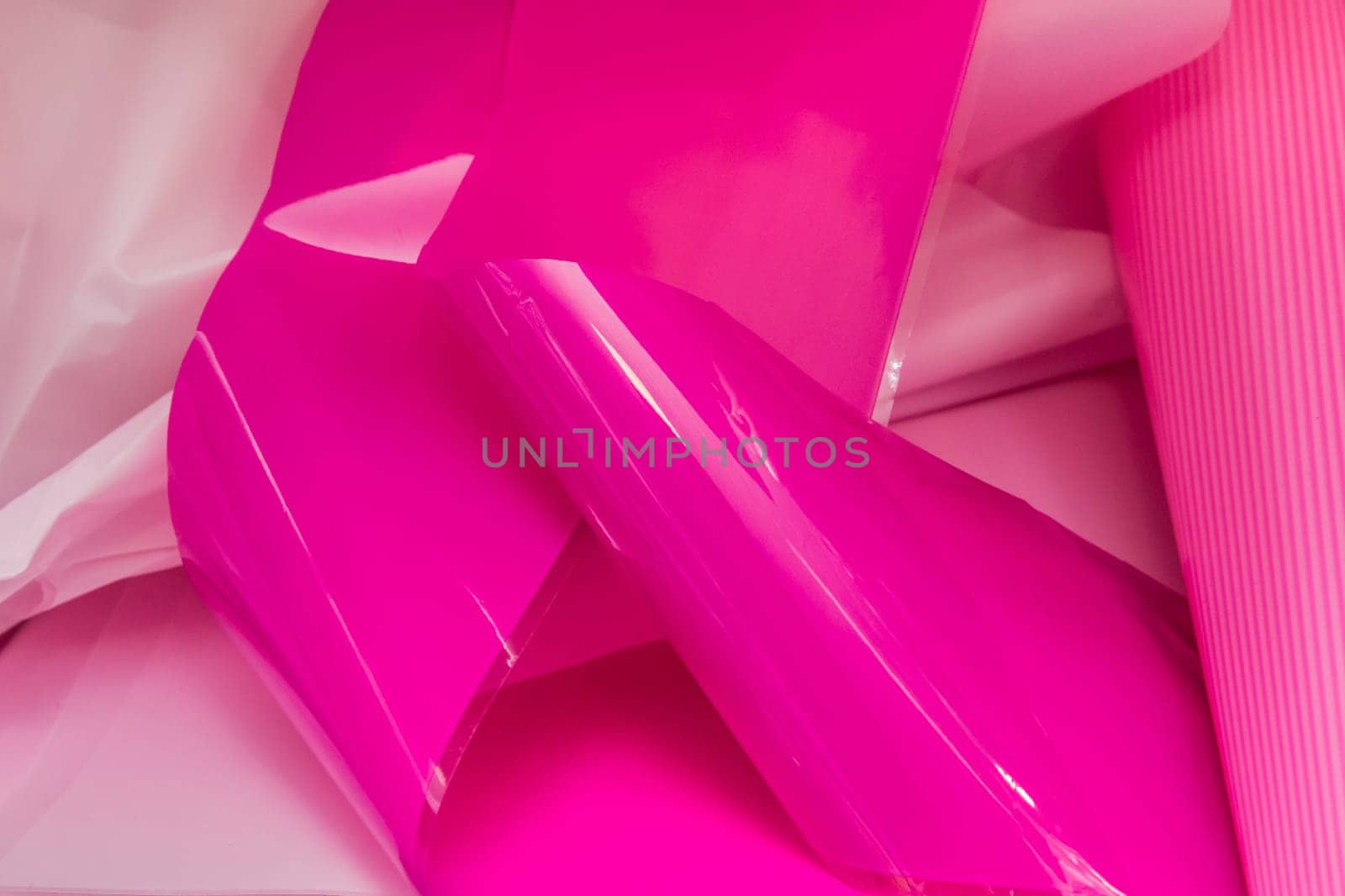 Plastic or polyethylene color pink packaging object wrapper material.