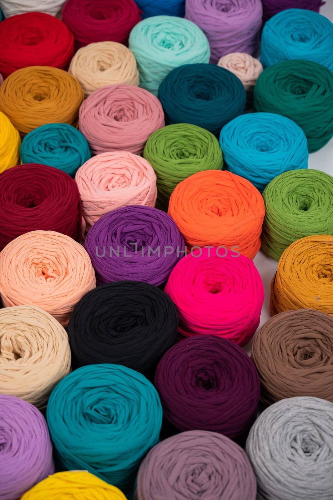 Close-up of multi-colored cotton skeins. Shop assortment for handmade by mrwed54