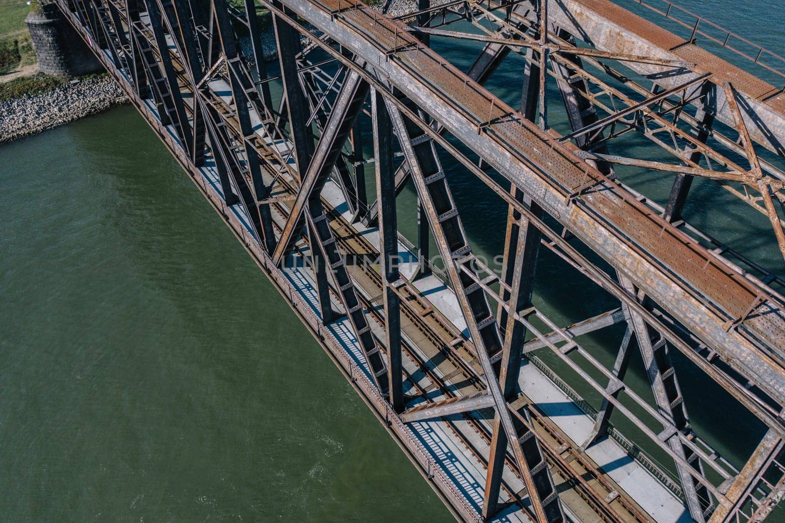 Iron Bridge Crossing a River Close Aerial View by cloudvisual