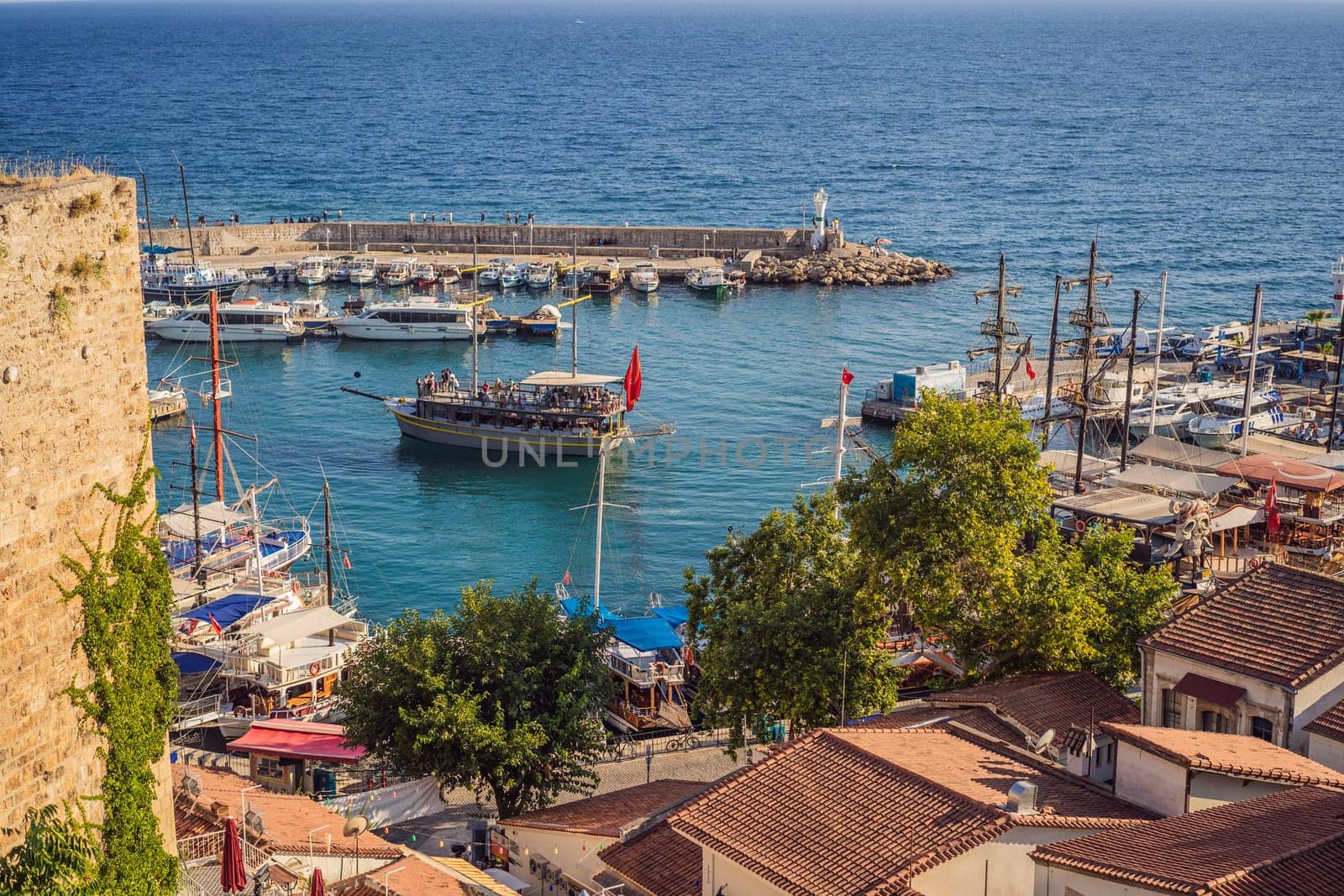 Old town Kaleici in Antalya. Panoramic view of Antalya Old Town port, Taurus mountains and Mediterrranean Sea, Turkey by galitskaya