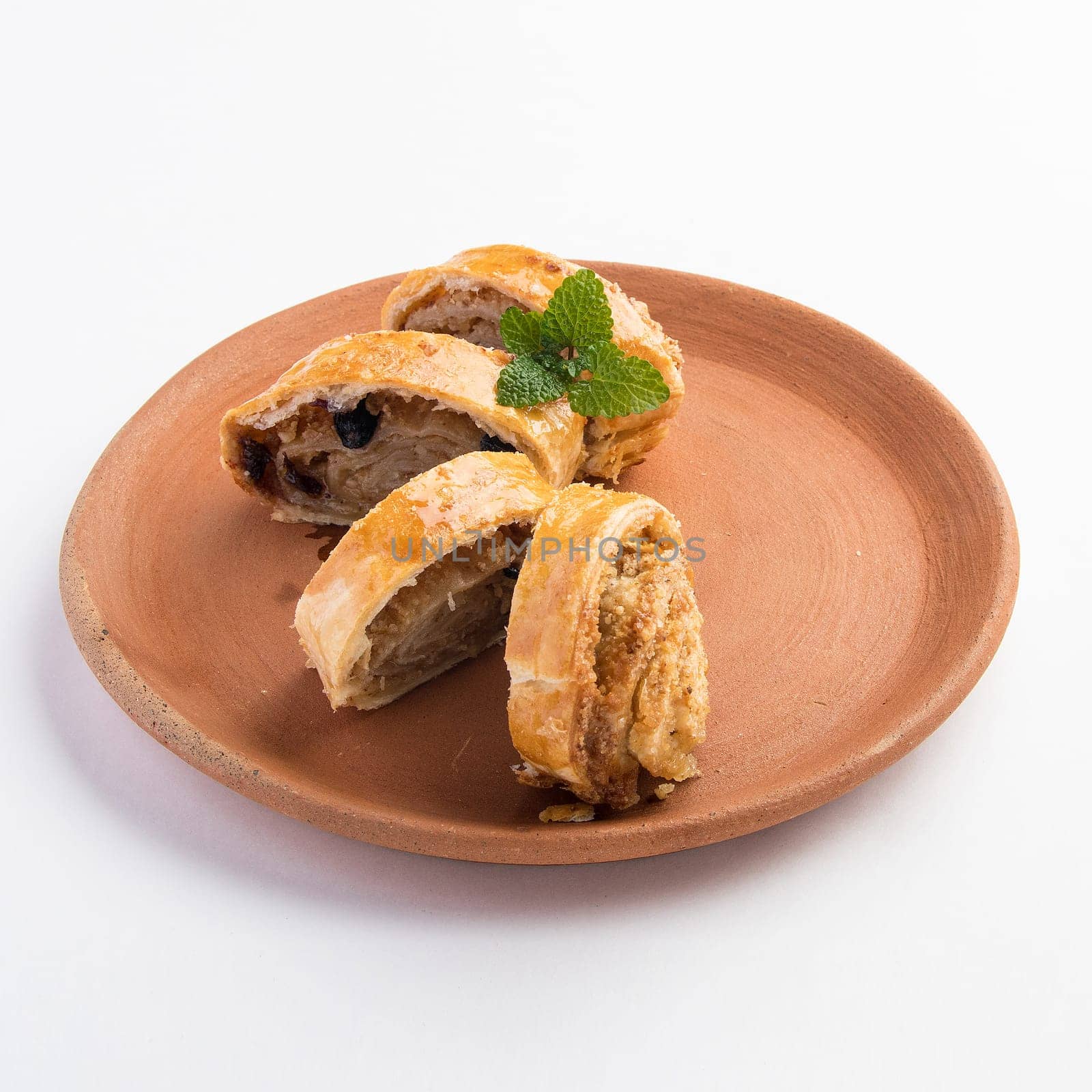 A beautiful shot of tasty sweet rolls with walnuts, raisins and sugar by A_Karim