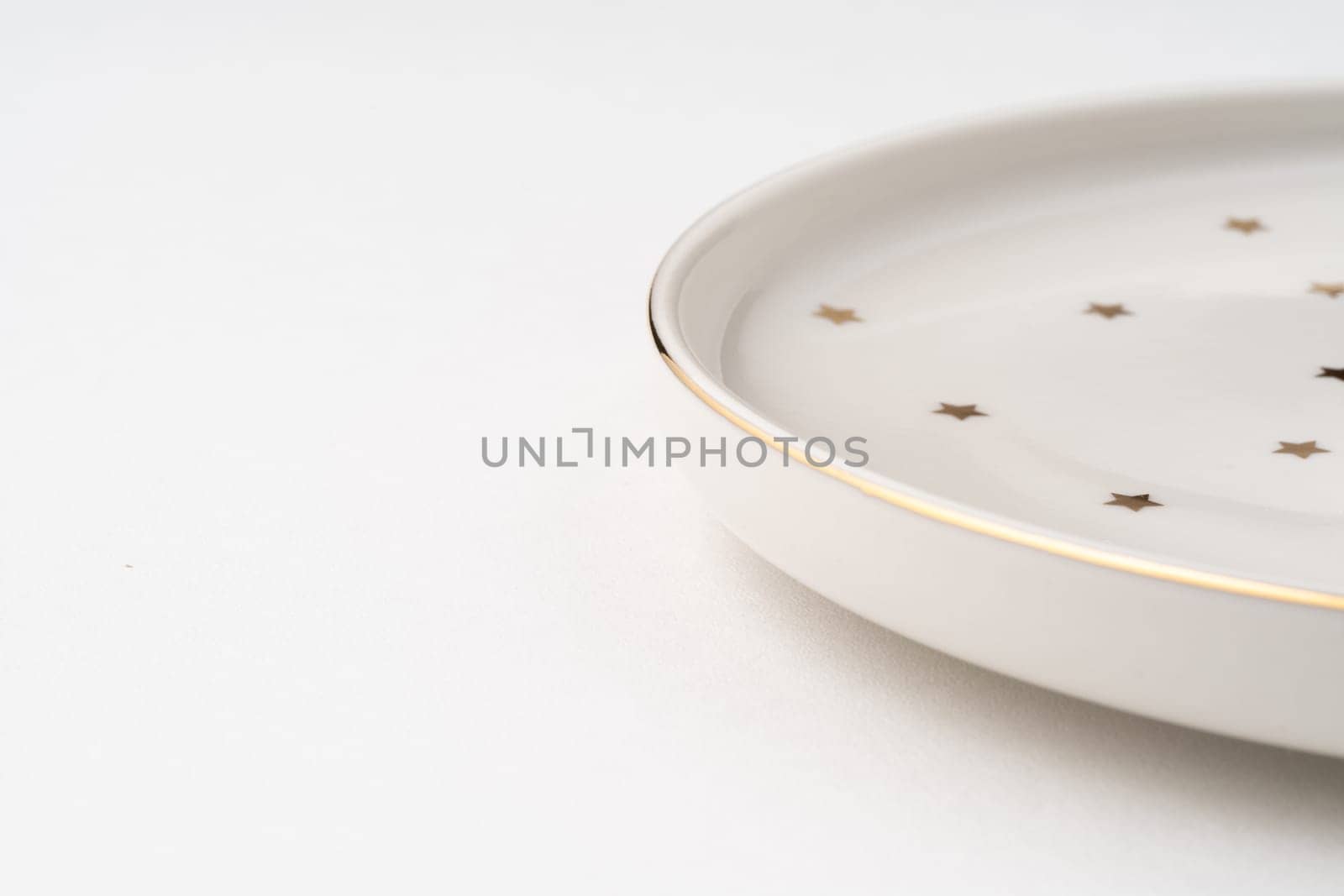 The one ceramic plate isolated on white background by A_Karim