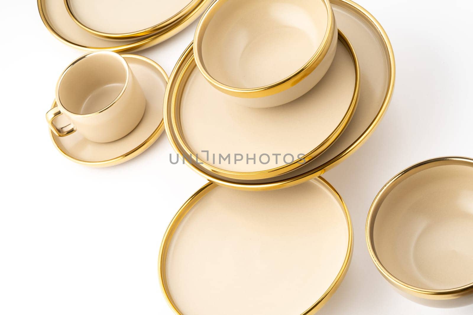 A Set of light brown ceramic plate and cup on a white background