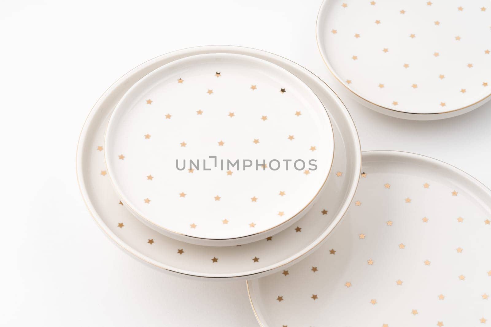 The ceramic plates isolated on white background by A_Karim