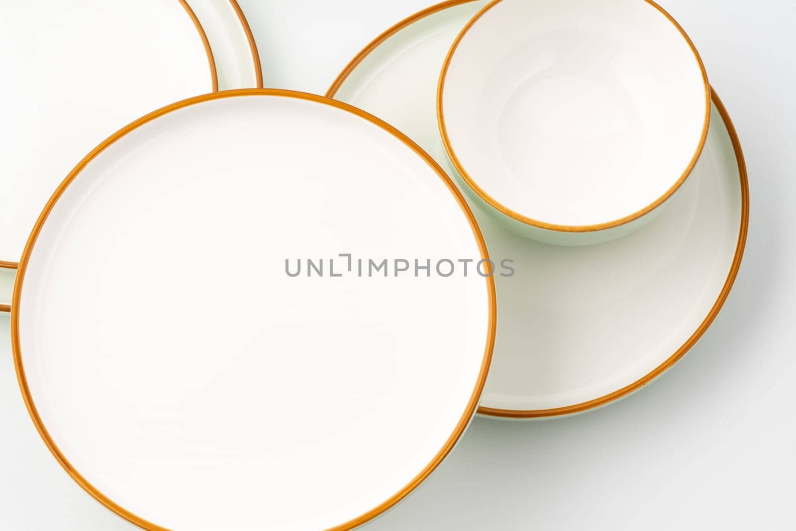 A set of ceramic tableware isolated on white background
