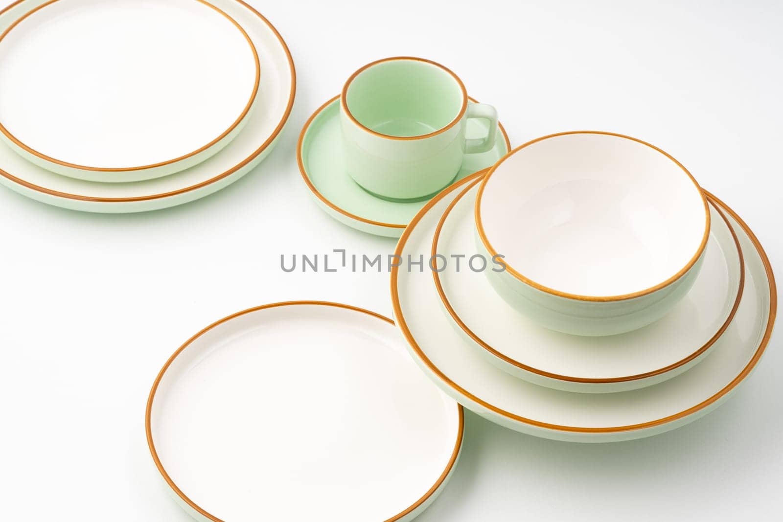 A set of ceramic tableware isolated on white background