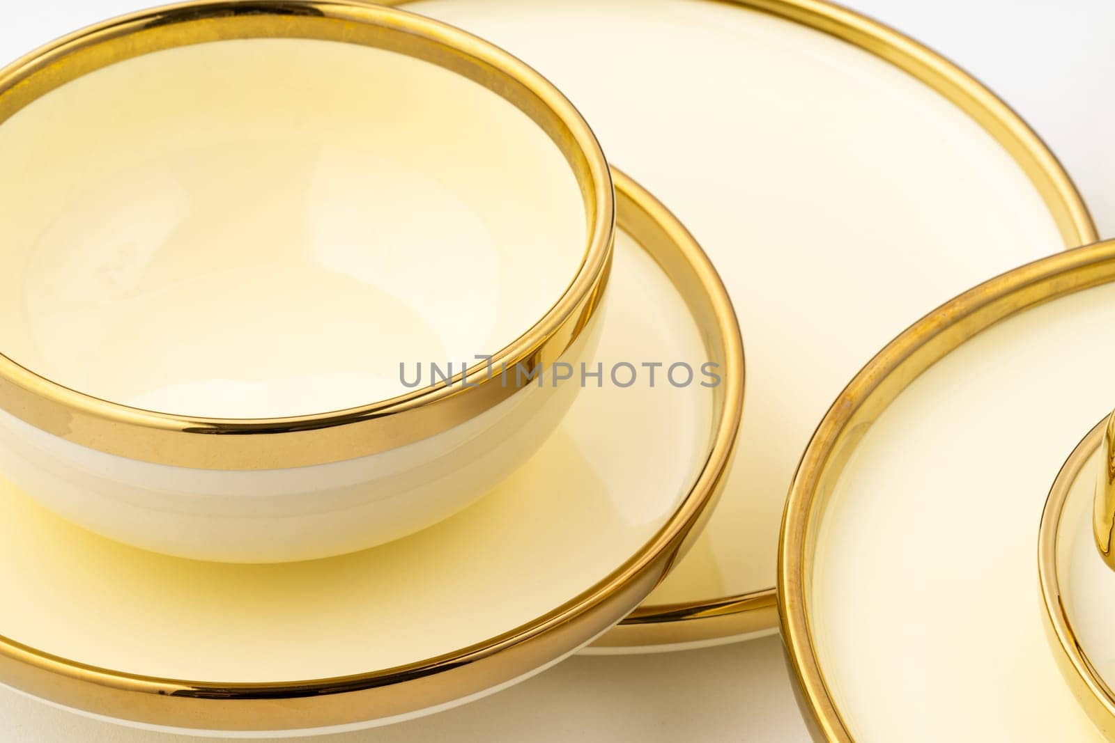 A golden luxury ceramic kitchen utensils on a white background