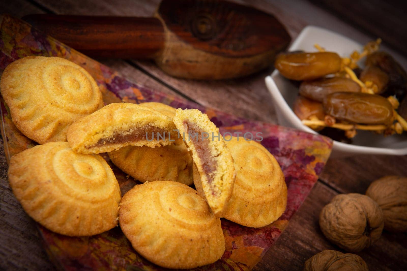 Traditional eid maamoul or mamoul cookies with dates, nuts, and jam, Arabic sweets for Aid al-Fitr and easter, High quality photo