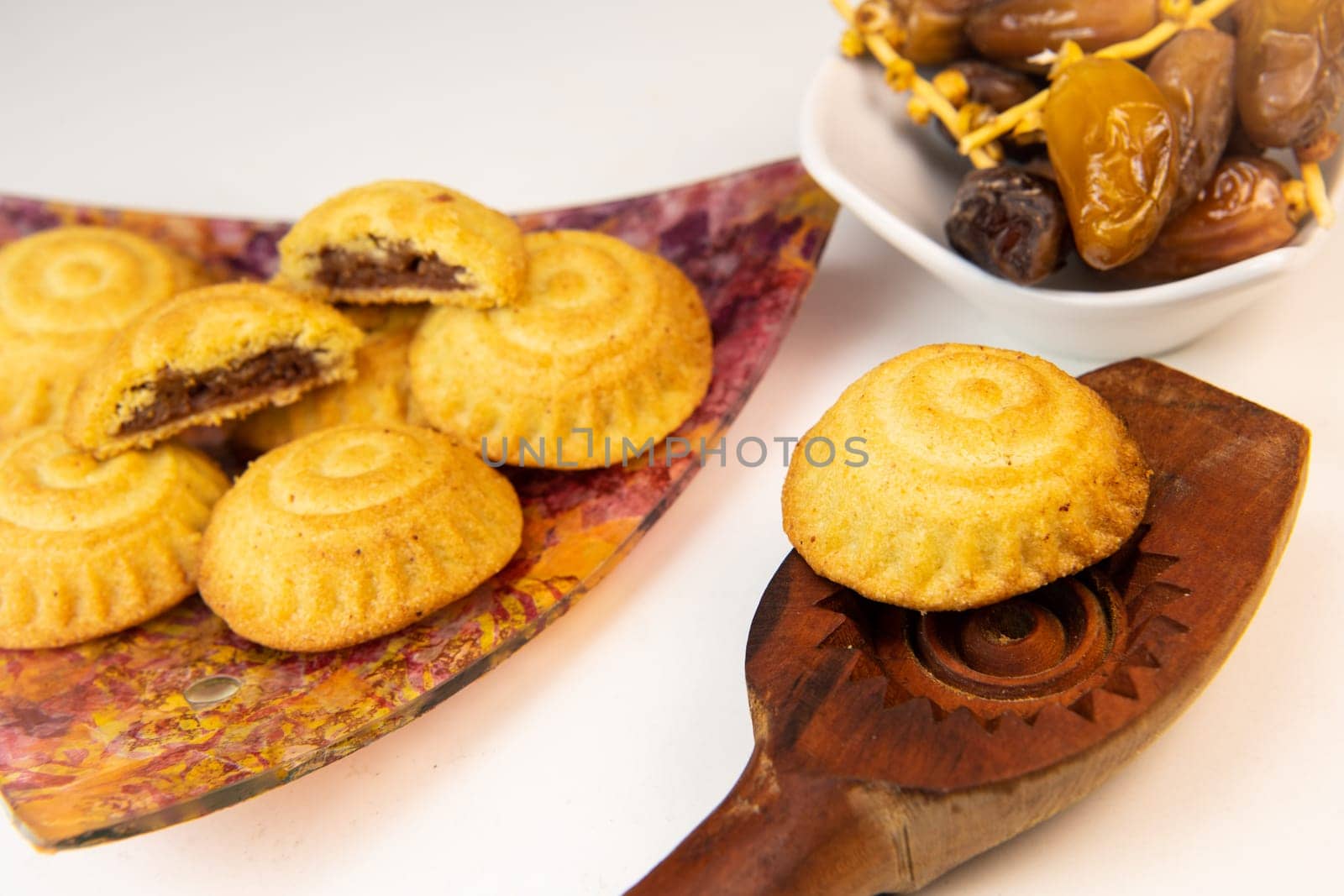 Traditional eid maamoul or mamoul cookies with dates, nuts, and jam, Arabic sweets for Aid al-Fitr and easter, High quality photo