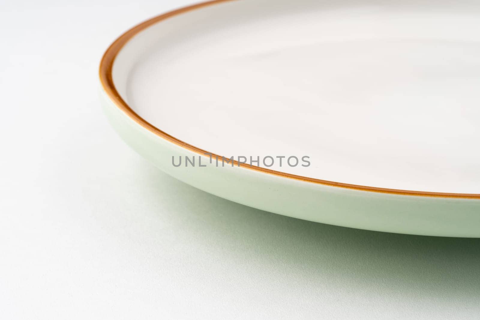 A one ceramic green plate isolated on white background by A_Karim