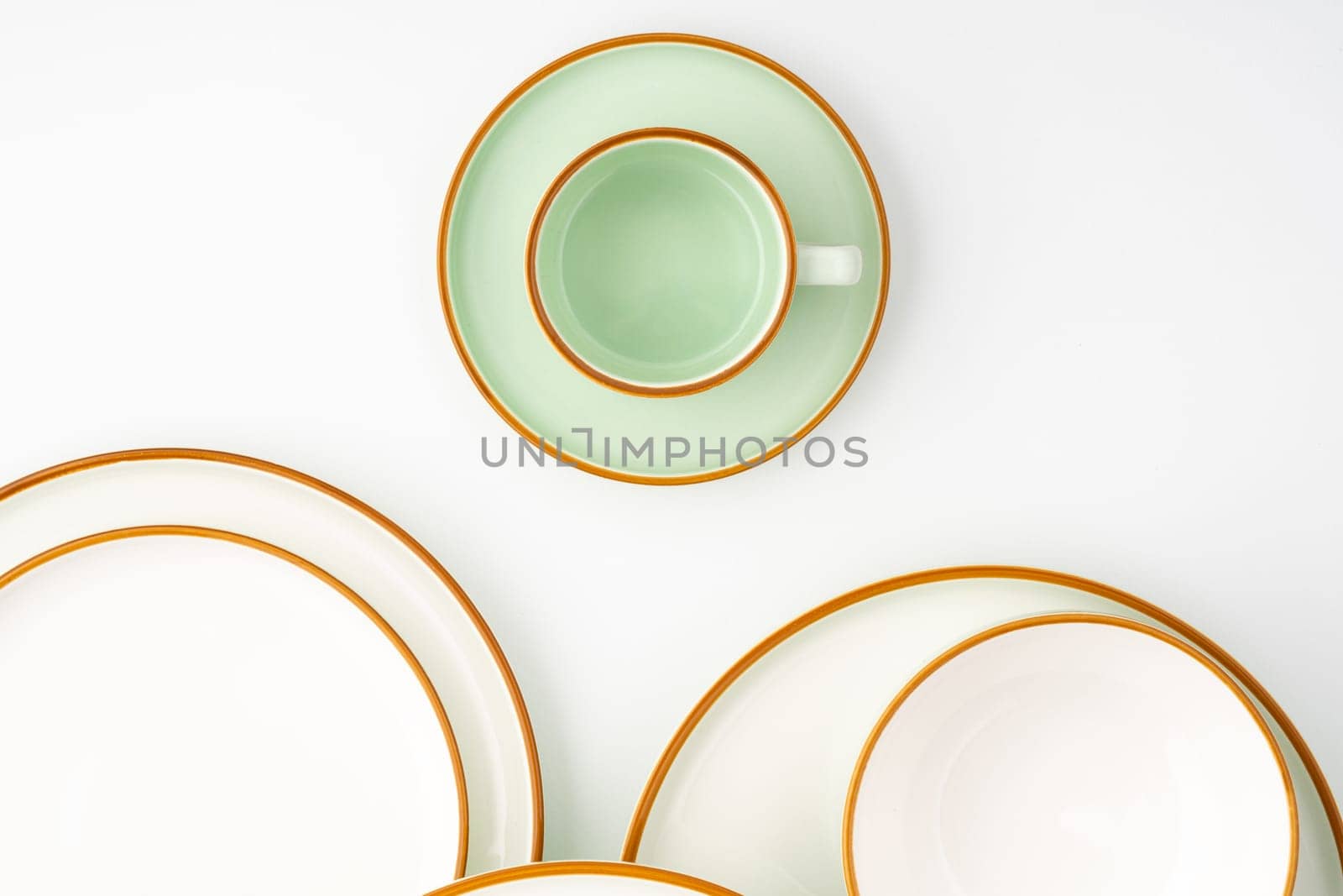 A set of ceramic tableware isolated on white background