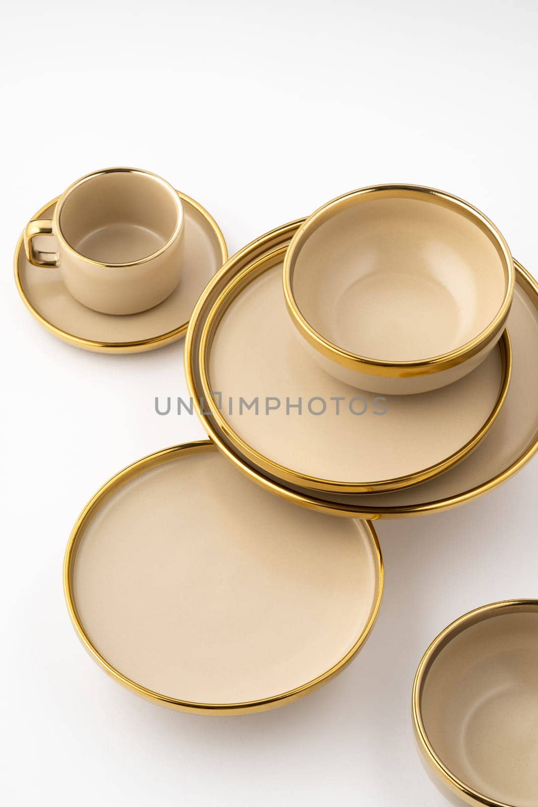 A Set of light brown ceramic plate and cup on a white background by A_Karim