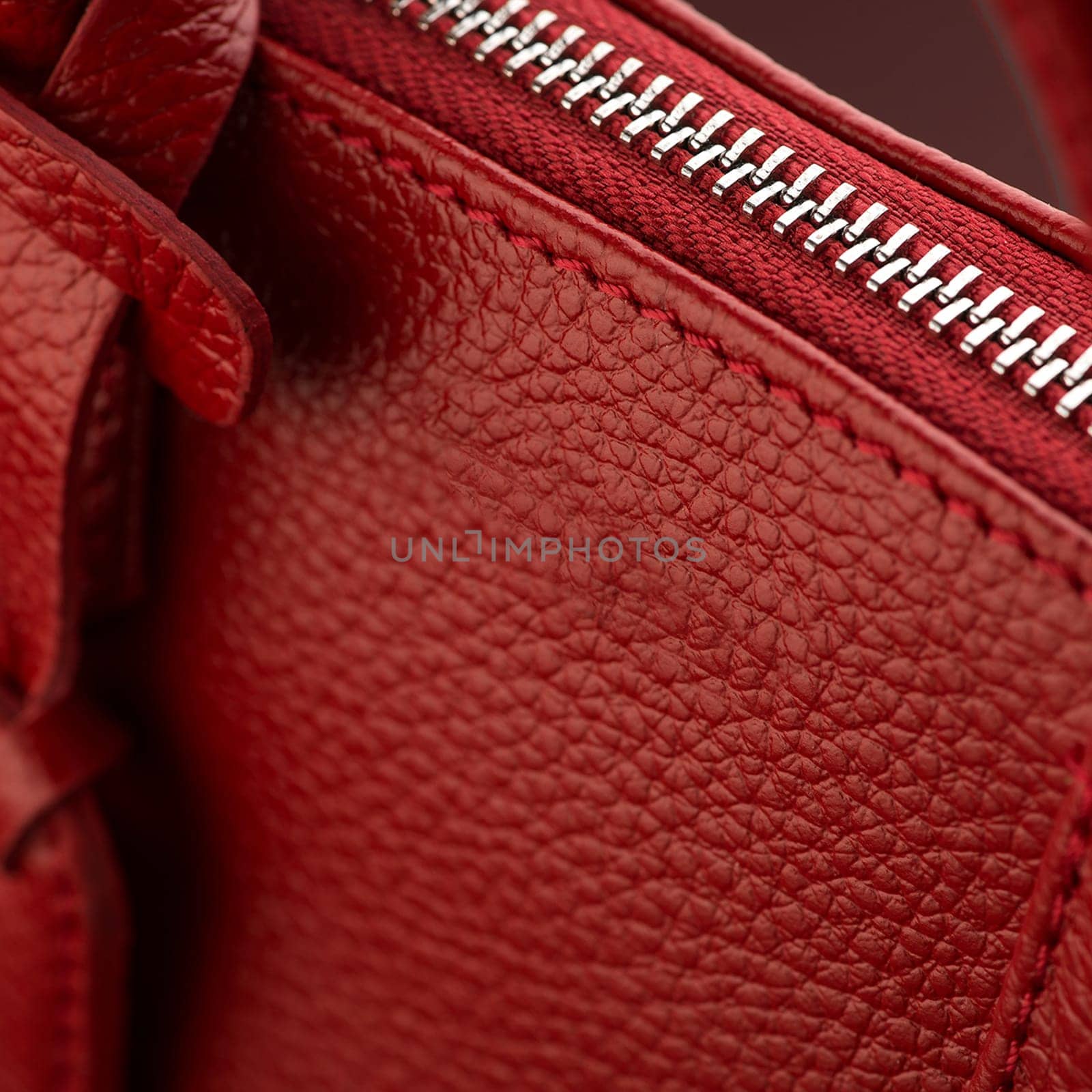 A closeup shot of a luxury red leather bag by A_Karim