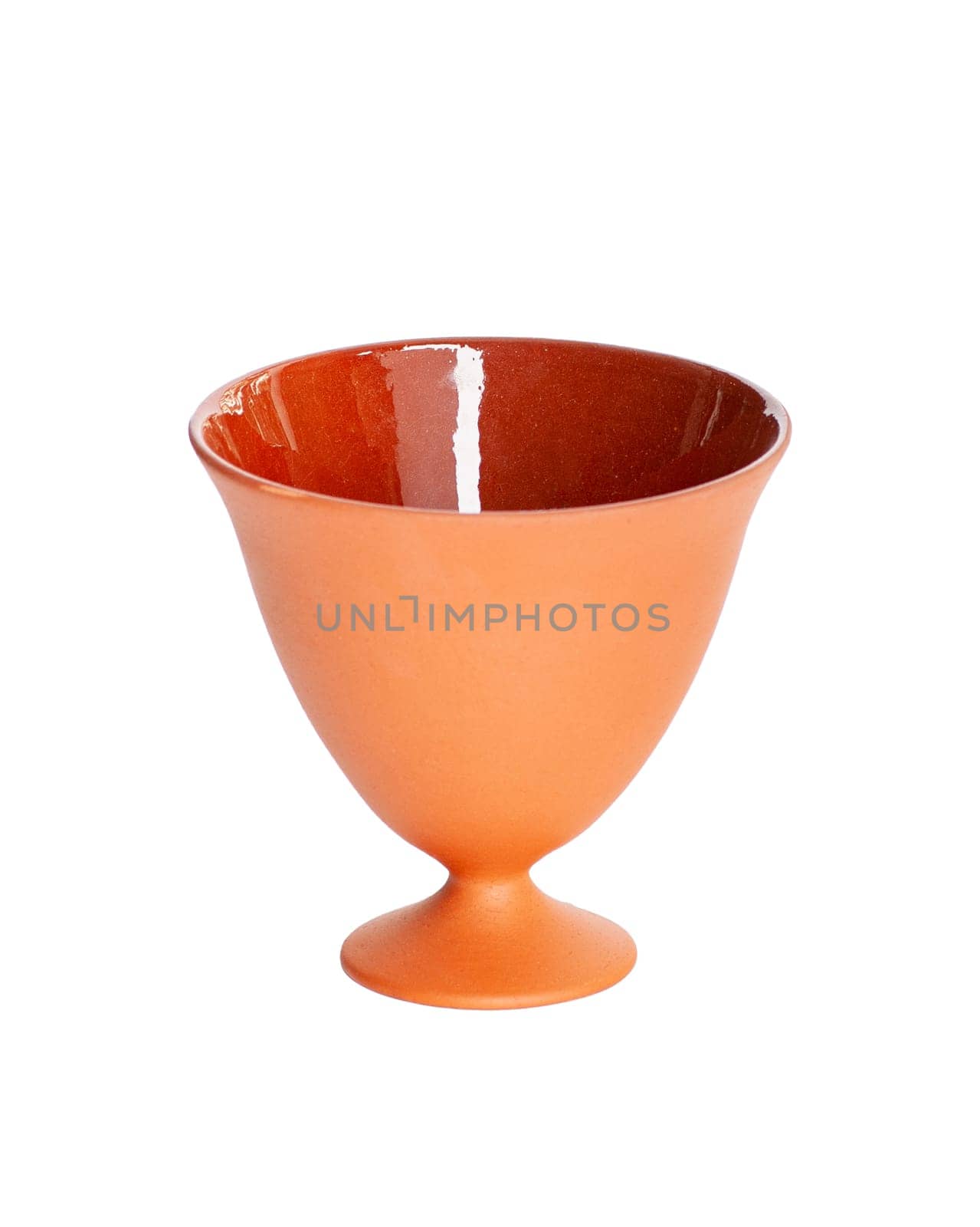 A brown clay bowl isolated on a white background