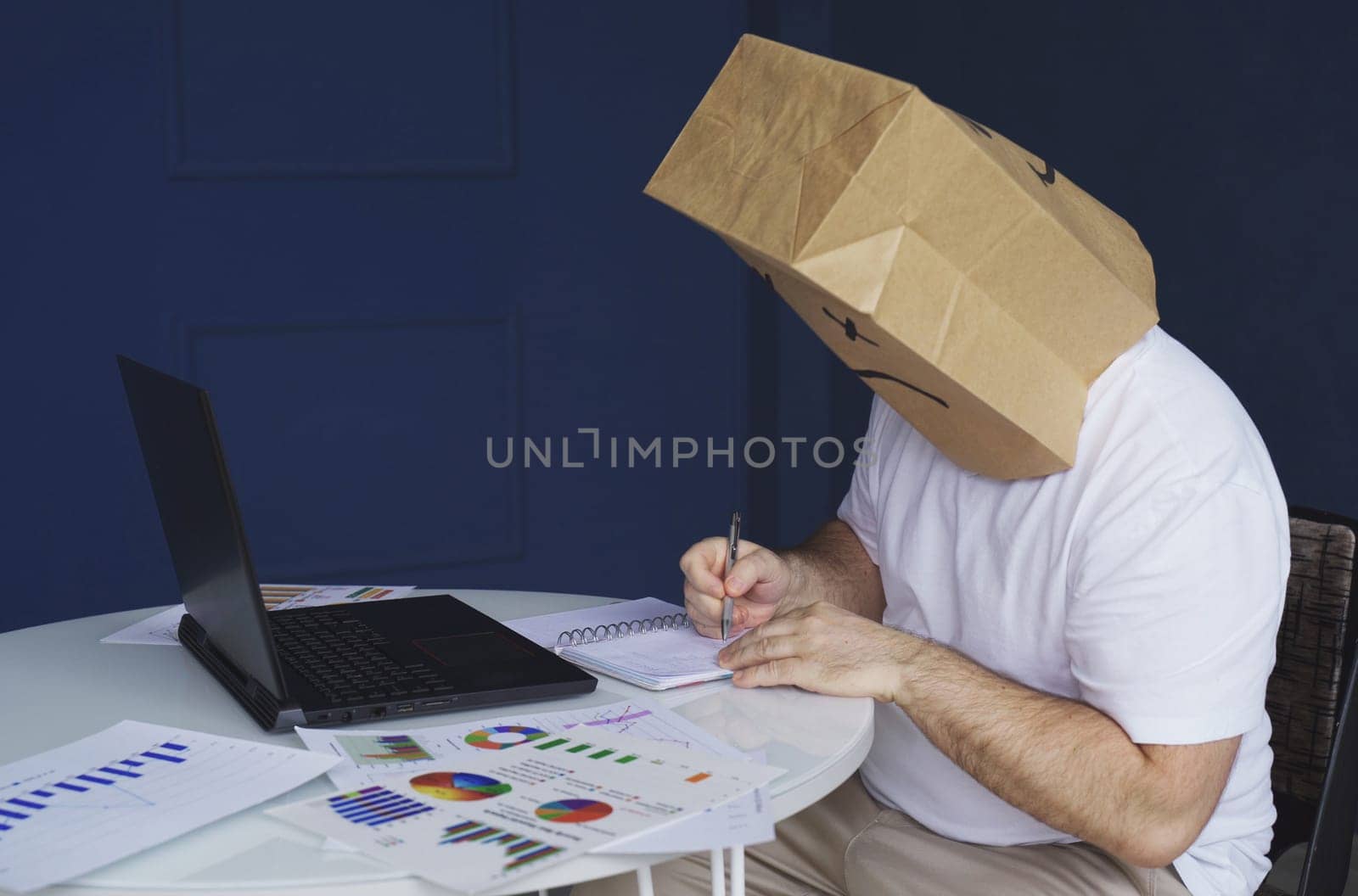 A man with a bag on his head with a drawn sad emoticon works by Sd28DimoN_1976