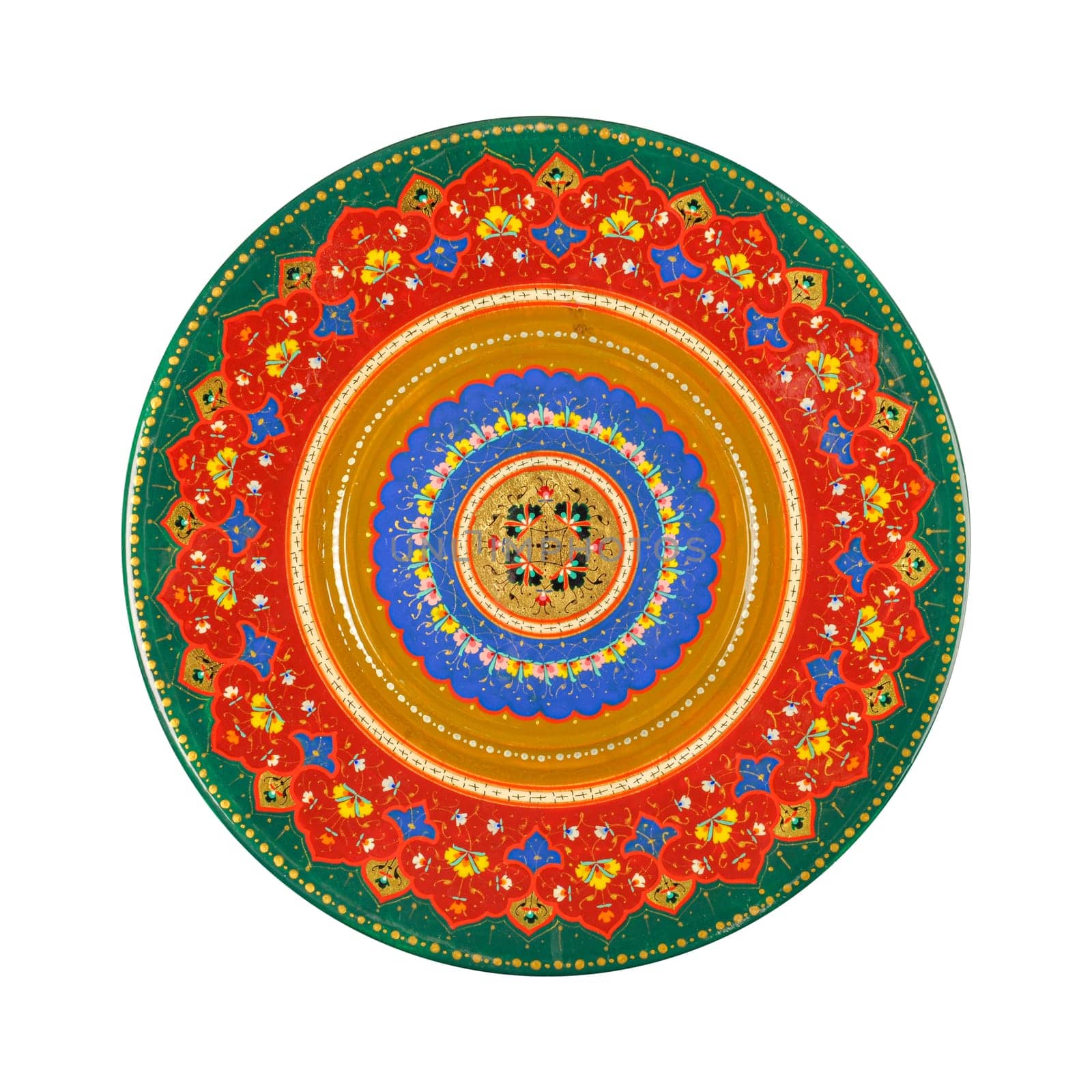 A top view of an oriental ceramic plate with a floral pattern on a white background, Uzbekistan