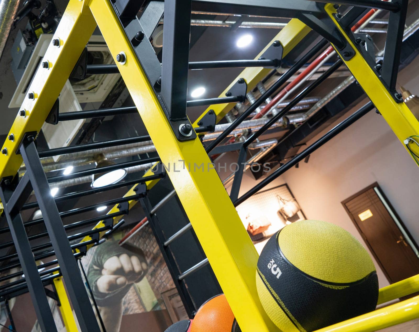 A vertical closeup of balls in the sports hall