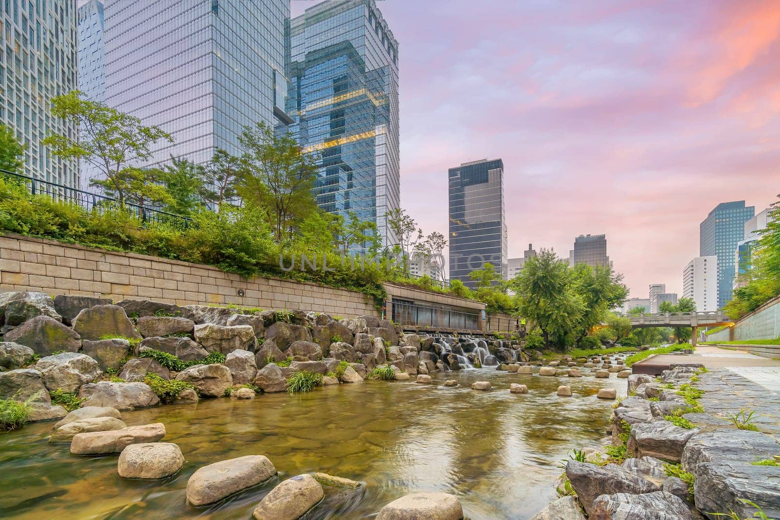 Cheonggyecheon, a modern public recreation space in downtown Seoul, South Korea at twilight