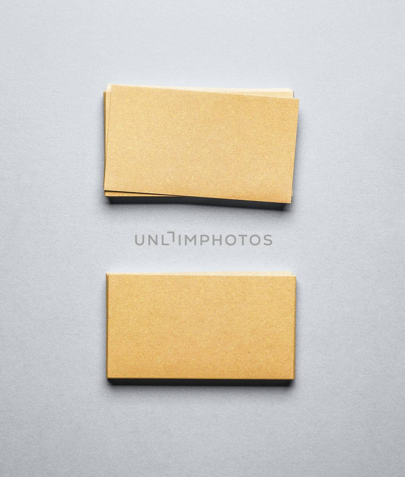 Blank golden business card on grey background by GekaSkr