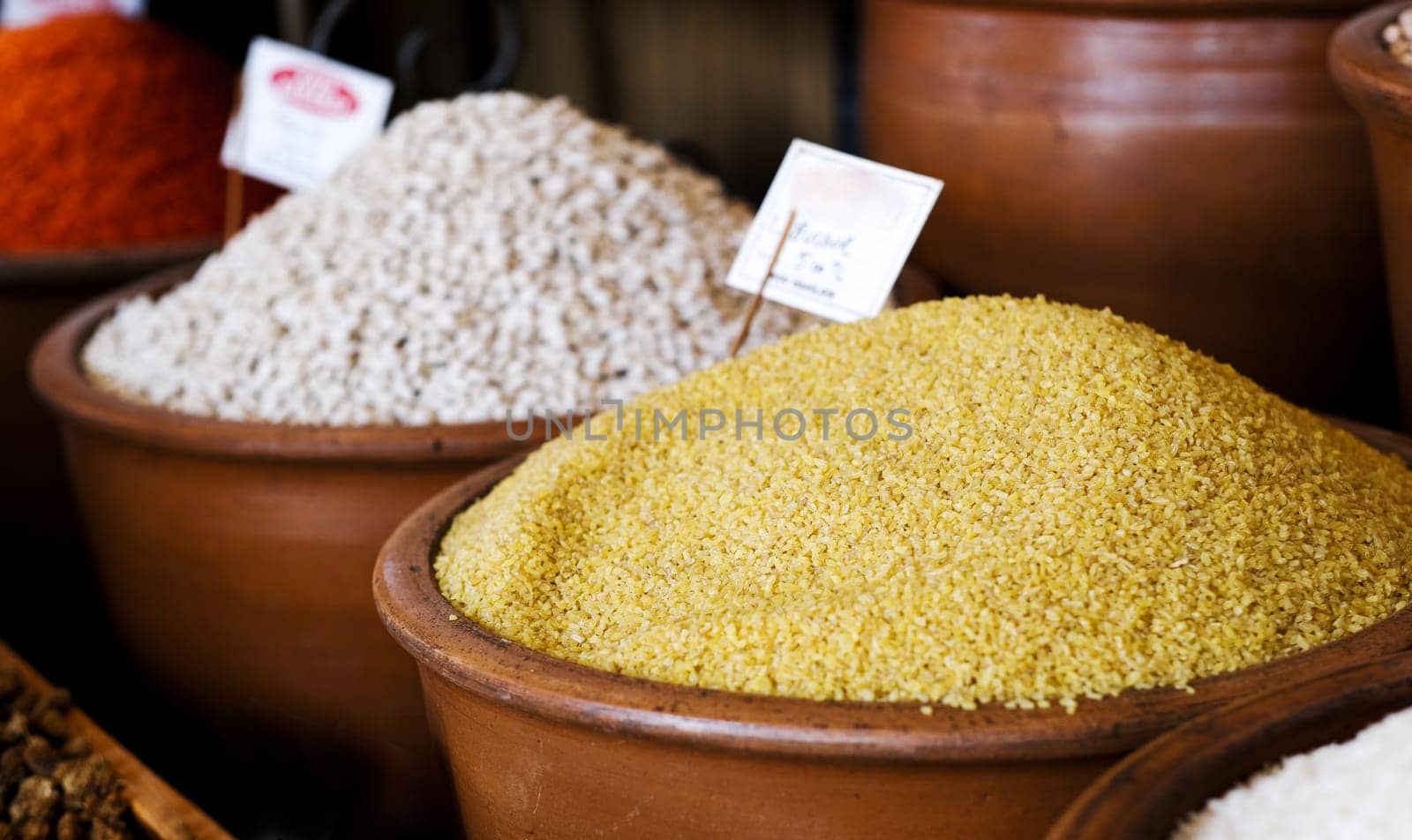 Bulgur in bowl for sell on market, selective focus