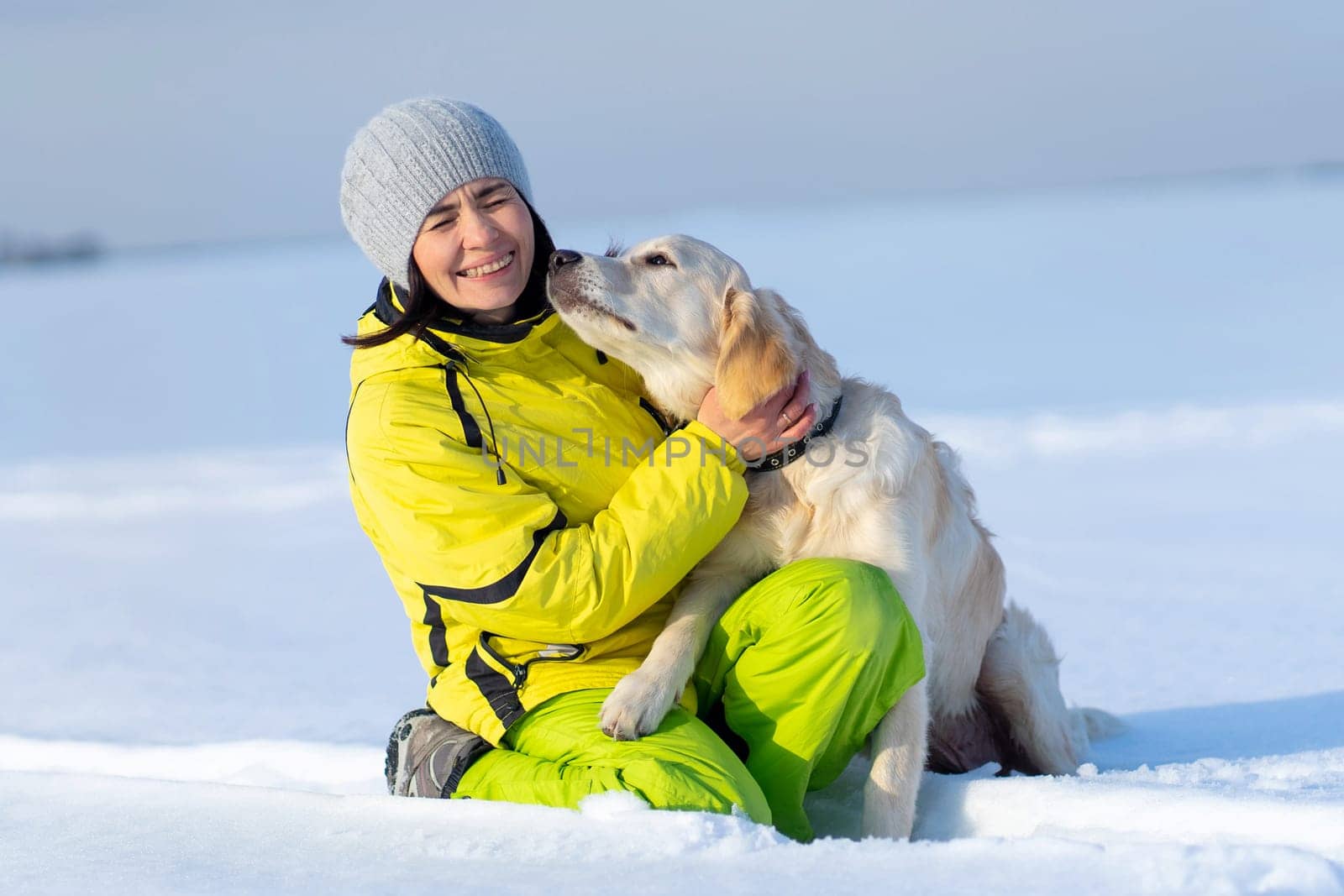 Cute dog kissing laughing woman by GekaSkr