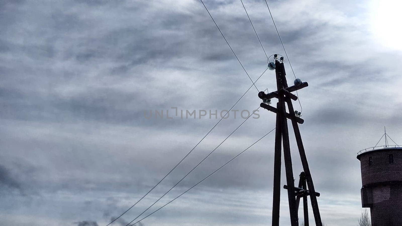 Power electric pole with line wire on blue background close up, photography consisting of power electric pole with line wire under sky, line wire in power electric pole for residential building