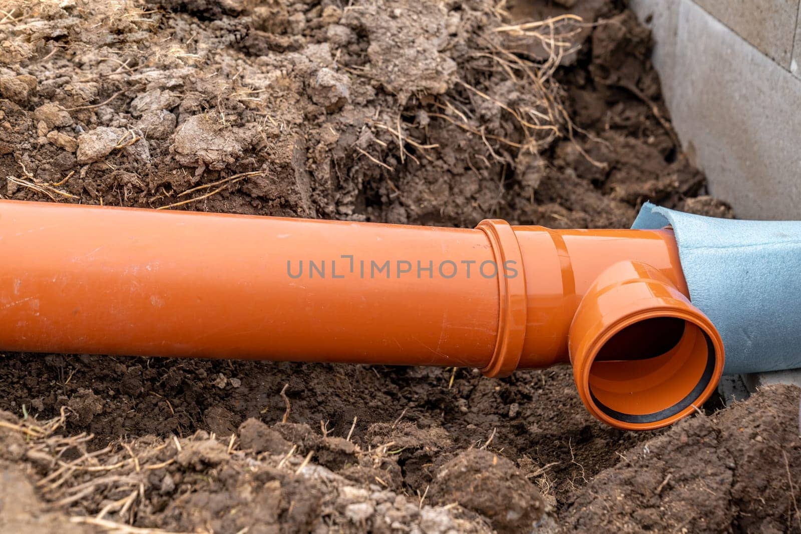 plastic pvc waste sewer pipe in the ground. High quality photo