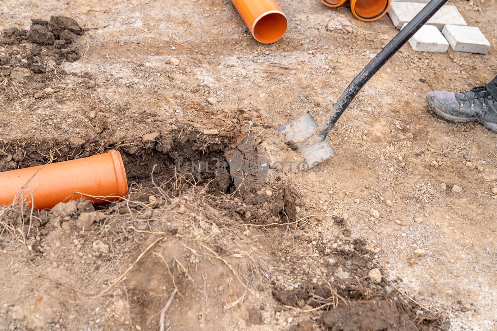 plastic pvc waste sewer pipe in the ground. High quality photo