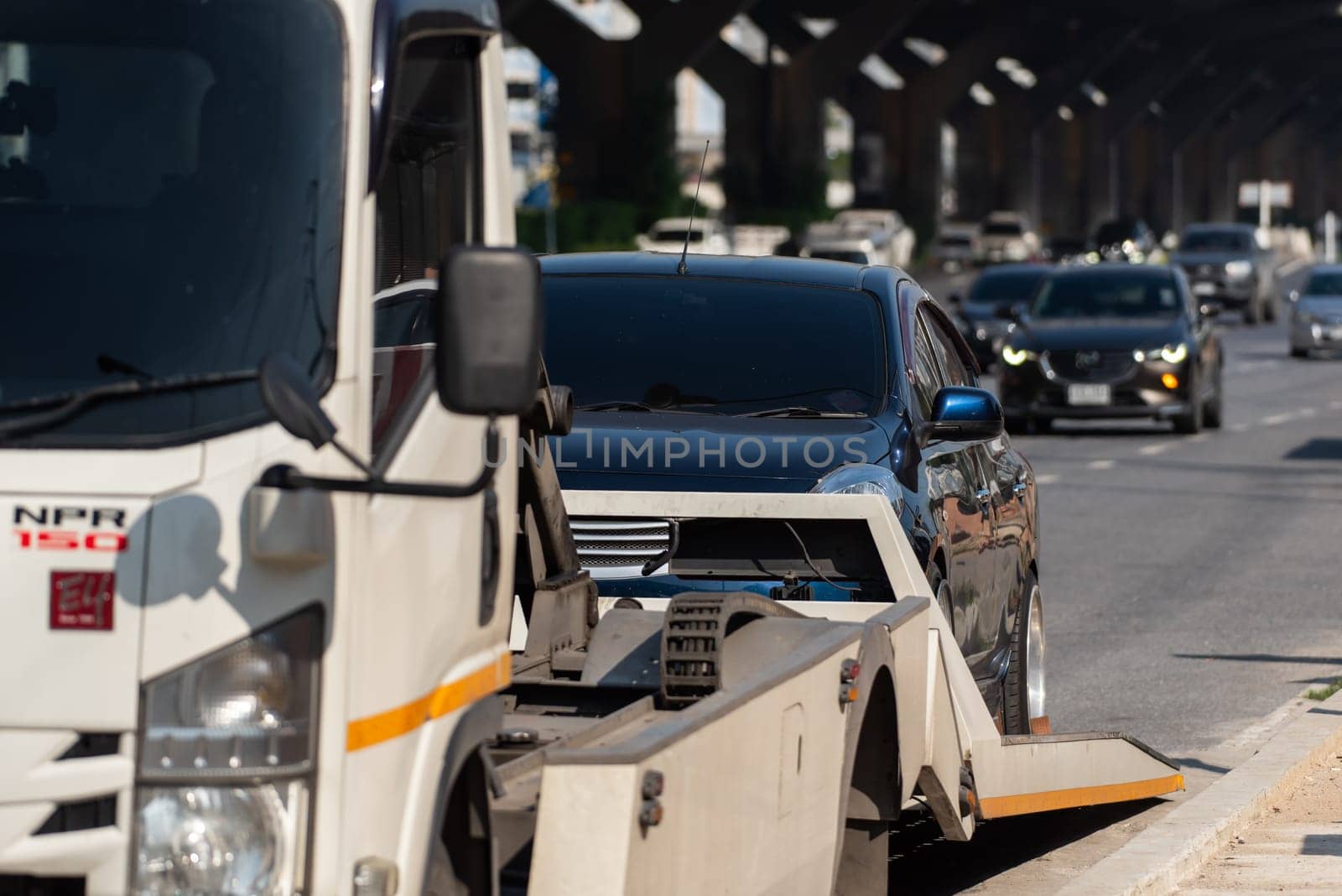 Bangkok, Thailand - November 22, 2022 : Car damaged crash from car accident on the road wait insurance in a city collision in Bangkok Road, accidents are a major problem of traffic in Thailand.