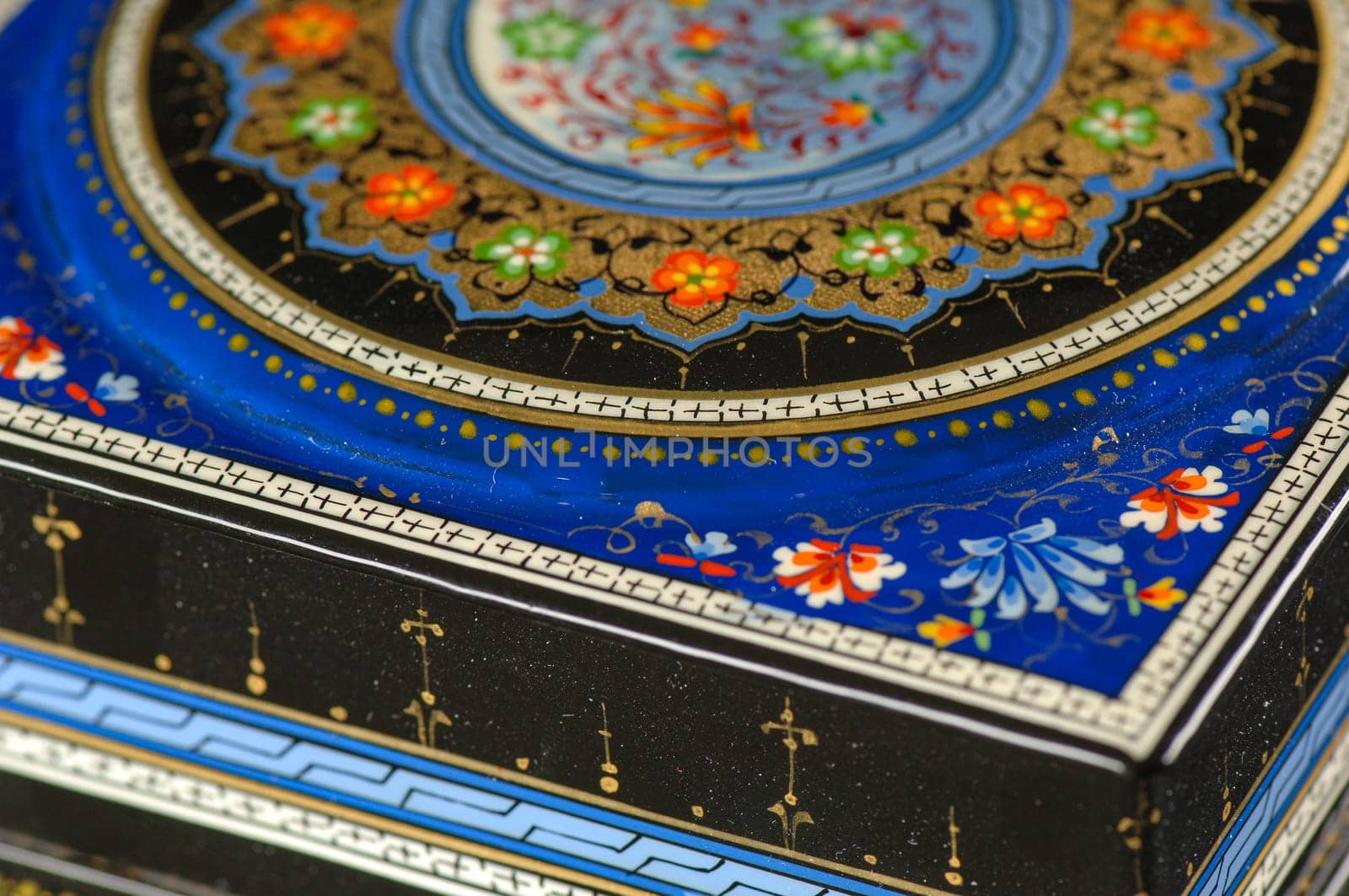 A closeup of a casket with an artistic painting on a black background. Central Asia, Uzbekistan by A_Karim