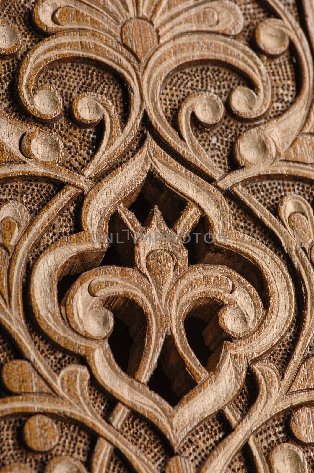 A close-up of vintage oriental artistic wood carving. Central Asia, Uzbekistan