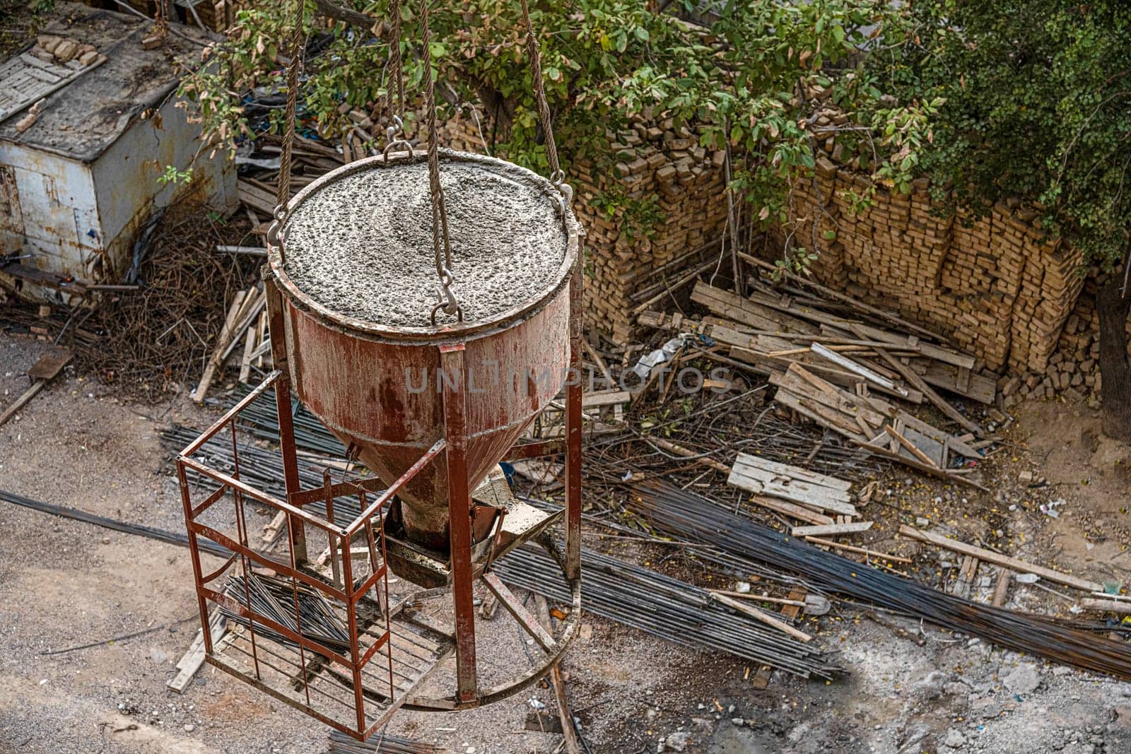 A high angle shot of a dirty construction site with machinery