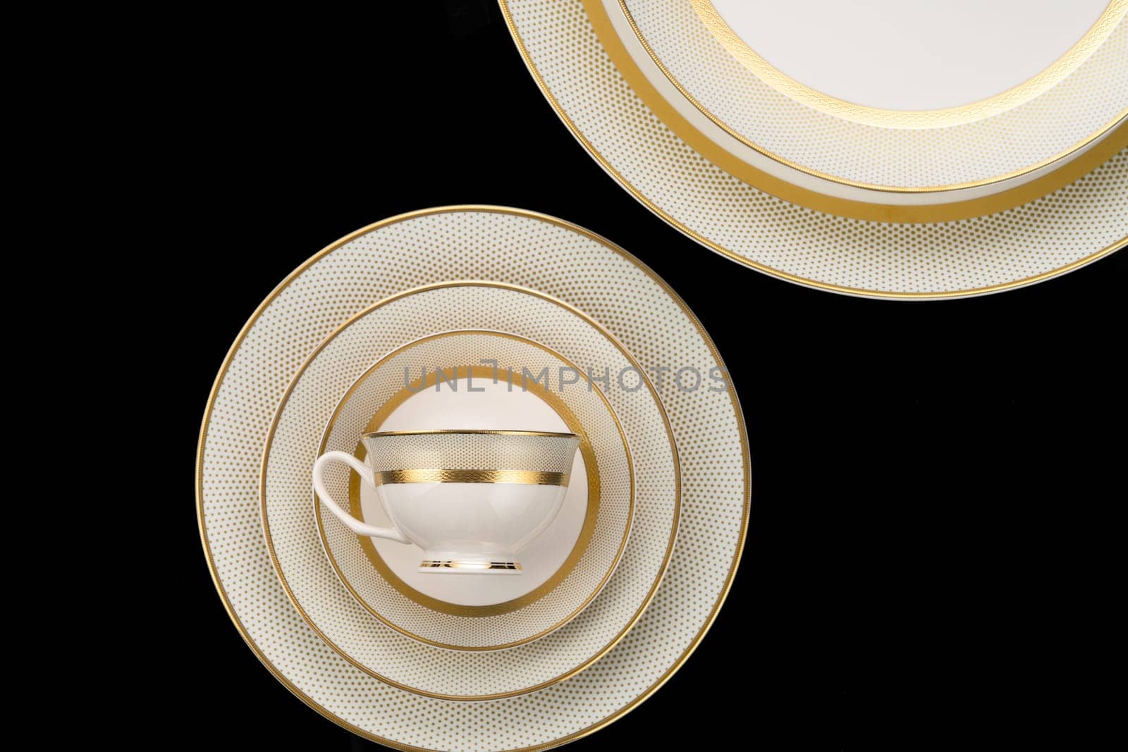 A luxury tableware set isolated on black background by A_Karim